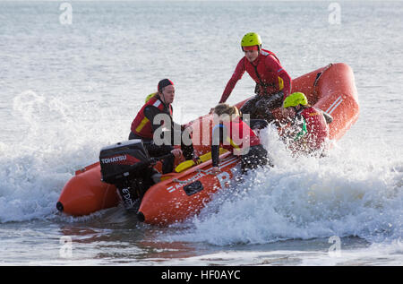 Durley Chine, Bournemouth, Dorset, UK. 26 December 2016. Bournemouth Lifeguard Corps give a demonstration of their lifesaving skills in the sea. The Corps, founded in 1965, is one of the largest and most successful volunteer lifeguard clubs in the UK with more than 100 members aged from 7 to 70. Credit: Carolyn Jenkins/Alamy Live News Stock Photo