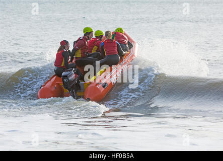 Durley Chine, Bournemouth, Dorset, UK. 26 December 2016. Bournemouth Lifeguard Corps give a demonstration of their lifesaving skills in the sea. The Corps, founded in 1965, is one of the largest and most successful volunteer lifeguard clubs in the UK with more than 100 members aged from 7 to 70. Credit: Carolyn Jenkins/Alamy Live News Stock Photo