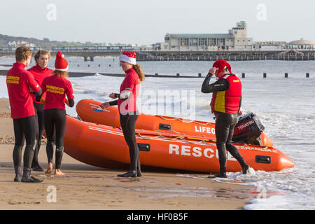 Durley Chine, Bournemouth, Dorset, UK. 26 December 2016. Bournemouth Lifeguard Corps give a demonstration of their lifesaving skills in the sea. The Corps, founded in 1965, is one of the largest and most successful volunteer lifeguard clubs in the UK with more than 100 members aged from 7 to 70. Credit: Carolyn Jenkins/Alamy Live News Stock Photo