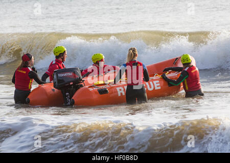 Durley Chine, Bournemouth, Dorset, UK. 26 December 2016. Bournemouth Lifeguard Corps give a demonstration of their lifesaving skills in the sea. The Corps, founded in 1965, is one of the largest and most successful volunteer lifeguard clubs in the UK with more than 100 members aged from 7 to 70. Credit: Carolyn Jenkins/Alamy Live News Stock Photo