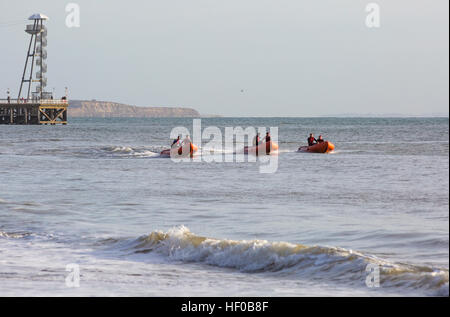 Durley Chine, Bournemouth, Dorset, UK. 26 December 2016. Bournemouth Lifeguard Corps give a demonstration of their lifesaving skills in the sea. The Corps, founded in 1965, is one of the largest and most successful volunteer lifeguard clubs in the UK with more than 100 members aged from 7 to 70. Credit: Carolyn Jenkins/Alamy Live News Stock Photo