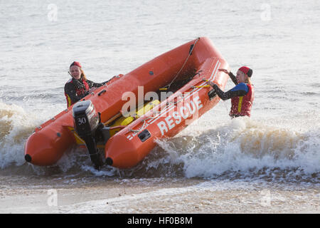 Durley Chine, Bournemouth, Dorset, UK. 26 December 2016. Bournemouth Lifeguard Corps give a demonstration of their lifesaving skills in the sea. The Corps, founded in 1965, is one of the largest and most successful volunteer lifeguard clubs in the UK with more than 100 members aged from 7 to 70. Credit: Carolyn Jenkins/Alamy Live News Stock Photo