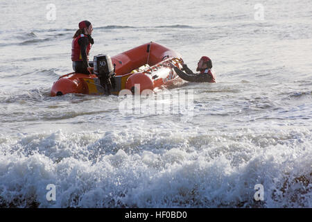 Durley Chine, Bournemouth, Dorset, UK. 26 December 2016. Bournemouth Lifeguard Corps give a demonstration of their lifesaving skills in the sea. The Corps, founded in 1965, is one of the largest and most successful volunteer lifeguard clubs in the UK with more than 100 members aged from 7 to 70. Credit: Carolyn Jenkins/Alamy Live News Stock Photo