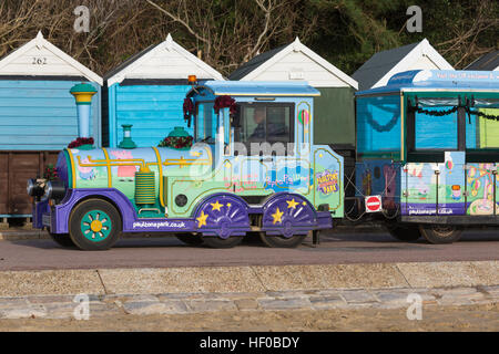 Bournemouth, Dorset, UK. 26 December 2016. The home of Peppa Pig world - Landtrain on the promenade at Middle Chine, Bournemouth with beach huts on Boxing Day on a lovely sunny day. Credit: Carolyn Jenkins/Alamy Live News Stock Photo