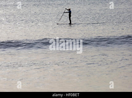 Bournemouth, Dorset, UK. 26 December 2016. Female paddle boarder paddleboarding at Bournemouth beach on a lovely sunny day on Boxing Day. Credit: Carolyn Jenkins/Alamy Live News Stock Photo