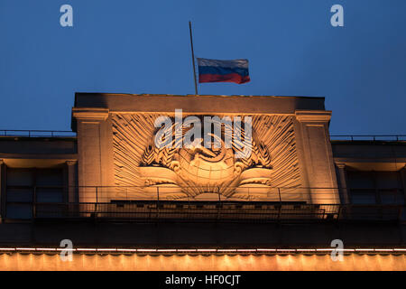 MOSCOW, RUSSIA - DECEMBER 26, 2016: A Russian flag flying at half-mast above the Russian State Duma building as Russia's President Vladimir Putin declares December 26, 2016 the Day of National Mourning for the victims of the Tupolev Tu-154 plane crash off Sochi coastline a day earlier. The plane of Russia's Defence Ministry bound for Russia's Hmeymim air base in Syria, was carrying members of the Alexandrov Ensemble, Russian servicemen and journalists, and Yelizaveta Glinka (known as Doctor Liza), Spravedlivaya Pomoshch [Just Aid] International Public Organisation director.