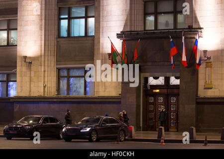 MOSCOW, RUSSIA - DECEMBER 26, 2016: Russian and Moscow flags flying with black ribbons outside the Russian State Duma building as Russia's President Vladimir Putin declares December 26, 2016 the Day of National Mourning for the victims of the Tupolev Tu-154 plane crash off Sochi coastline a day earlier. The plane of Russia's Defence Ministry bound for Russia's Hmeymim air base in Syria, was carrying members of the Alexandrov Ensemble, Russian servicemen and journalists, and Yelizaveta Glinka (known as Doctor Liza), Spravedlivaya Pomoshch [Just Aid] International Public Organisation director. Stock Photo