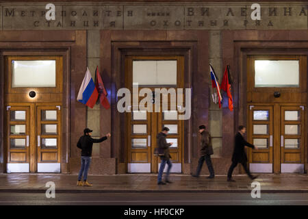 MOSCOW, RUSSIA - DECEMBER 26, 2016: Russian and Moscow flags flying with black ribbons outside the Moscow Metro's Okhotny Ryad station as Russia's President Vladimir Putin declares December 26, 2016 the Day of National Mourning for the victims of the Tupolev Tu-154 plane crash off Sochi coastline a day earlier. The plane of Russia's Defence Ministry bound for Russia's Hmeymim air base in Syria, was carrying members of the Alexandrov Ensemble, Russian servicemen and journalists, and Yelizaveta Glinka (known as Doctor Liza), Spravedlivaya Pomoshch [Just Aid] International Public Organisation dir Stock Photo