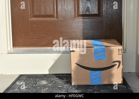 Washington DC, USA - December 27, 2016: An Amazon Prime package delivered to the front door of a home after a busy holiday season. Amazon Prime is a popular service among US consumers for shopping online. Stock Photo
