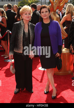 FILE PIC: Los Angeles, CA, USA. 10th Sep, 2011. 27 December 2016 - Carrie Fisher, the iconic actress who portrayed Princess Leia in the Star Wars series, died Tuesday following a massive heart attack. Carrie Frances Fisher an American actress, screenwriter, author, producer, and speaker, was the daughter of singer Eddie Fisher and actress Debbie Reynolds. File Photo: 10 September 2011 - Los Angeles, California - Debbie Reynolds, Carrie Fisher. 2011 Primetime Creative Arts Emmy Awards Held at The Nokia Theatre L.A. Live. Credit: ZUMA Press, Inc./Alamy Live News Stock Photo