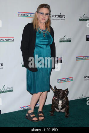 FILE PIC: Hollywood, CA, USA. 19th Feb, 2015. 27 December 2016 - Carrie Fisher, the iconic actress who portrayed Princess Leia in the Star Wars series, died Tuesday following a massive heart attack. Carrie Frances Fisher an American actress, screenwriter, author, producer, and speaker, was the daughter of singer Eddie Fisher and actress Debbie Reynolds. File Photo: 19 February 2015 - Santa Monica, Ca - Carrie Fisher. Arrivals for the Oscar Wilde US-Ireland Alliance Pre-Academy Award event held at Bad Robot. Credit: ZUMA Press, Inc./Alamy Live News Stock Photo