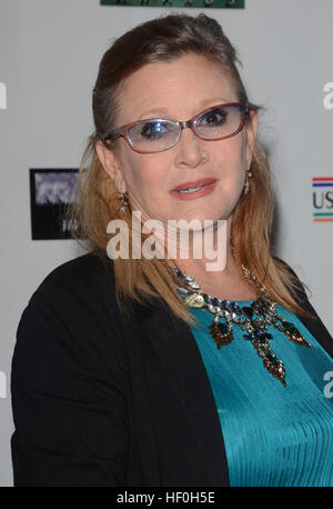 FILE PIC: Hollywood, CA, USA. 19th Feb, 2015. 27 December 2016 - Carrie Fisher, the iconic actress who portrayed Princess Leia in the Star Wars series, died Tuesday following a massive heart attack. Carrie Frances Fisher an American actress, screenwriter, author, producer, and speaker, was the daughter of singer Eddie Fisher and actress Debbie Reynolds. File Photo: 19 February 2015 - Santa Monica, Ca - Carrie Fisher. Arrivals for the Oscar Wilde US-Ireland Alliance Pre-Academy Award event held at Bad Robot. Credit: ZUMA Press, Inc./Alamy Live News Stock Photo