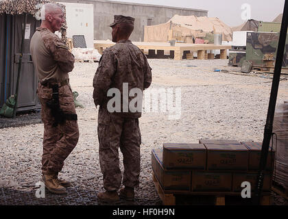 FORWARD OPERATING BASE DELHI, Helmand province, Islamic Republic of Afghanistan — Lt. Col. Sean Riordan speaks to Maj. Gen. John Toolan Jr. about recent construction and improvements here after Toolan arrived for an official visit here, June 14. Toolan, a native of Brooklyn, N.Y., is the commanding general of Regional Command Southwest. Riordan, a native of Montclair, Va., is the battalion commander of 1st Battalion, 3rd Marine Regiment. Toolan and Sgt. Maj. Michael Jones, sergeant major for RC(SW), were briefed by the battalion staff about the progress and ongoing operations in Garmsir Distri Stock Photo