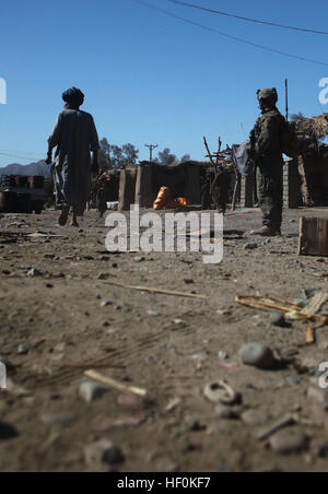 A Marine with 2nd Platoon, Bravo Company, 1st Battalion, 6th Marine Regiment, provides security during a recent patrol through the Kajaki Sofla Bazaar. The unit is working with their Afghan counterparts in Operation Eastern Storm to eliminate insurgents in the area, making it safe for residents to return to their homes. Operation Eastern Storm returns commerce, residents to Kajaki Sofla Bazaar DVIDS482250 Stock Photo