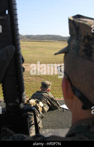 Recruit Garrett Campbell, Platoon 3254, Company L, 3rd Recruit Training Battalion, shoots from the prone position on Delta Range, Edson Range, Weapons and Field Training Battalion, Marine Corps Base Camp Pendleton March 20. Primary marksmanship instructors were there to help ensured the recruits understood how to properly us the M-16 A4 service rifle. Company L recruits apply Marine Corps marksmanship skills 120320-M-BJ232-122 Stock Photo