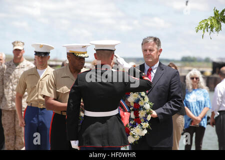 The Traveling Vietnam War Memorial Wall in Cleveland's Voinovich Park drew crowds as Brook Park Mayor Mark J. Elliott and Brig. Gen. Vincent R. Stewart, director of Intelligence, Headquarters Marine Corps, prepare to lay a wreath June 13 before the names of those killed during the Vietnam War. Other displays open to the public will be located at Gateway Plaza and the Rock and Roll Hall of Fame. Marine Week Cleveland runs June 11-17 and celebrates the community, the country and the Corps. Mayor joins Marines for wreath laying 120613-M-ZB219-011 Stock Photo