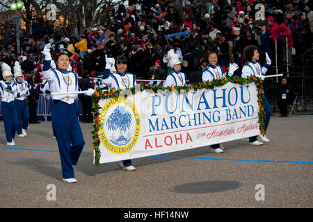 President Barack Obama watches the Punahou Marching Band from the parade's official review stand. Punahou Marching Band members are from the college preparatory school located in Honolulu, Hawaii. President Obama graduated from Punahou in 1979. (Official U.S. Air Force photo by Tech. Sgt. Eric Miller/ New York Air National Guard) President Obama's alma mater high school marches in 57th Presidential Inaugural Parade 130121-Z-QU230-247 Stock Photo