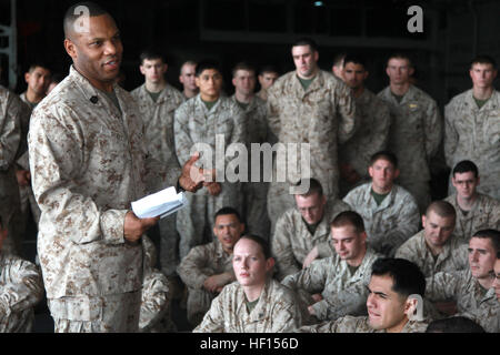 Sergeant Maj. John W. Scott, sergeant major, 15th Marine Expeditionary Unit, address his Marines and sailors after a promotion and awards ceremony held in the hangar bay of the USS Peleliu, Feb. 1. The 15th MEU is deployed as part of the Peleliu Amphibious Ready Group as a U.S. Central Command theater reserve force, providing support for maritime security operations and theater security cooperation efforts in the U.S. 5th Fleet area of responsibility. (U.S. Marine Corps photo by Cpl. John Robbart III) Peleliu February Promotions 130201-M-YG378-102 Stock Photo