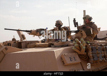 U.S. Marine Corps M1A1 Abrams tank crewmen assigned to Delta Company, 1st Tank Battalion, leave to conduct actions in support of Operation Dynamic Partnership in Shurakay, Helmand province, Afghanistan, Feb. 10, 2013. Dynamic Partnership was a multi-unit operation to retrograde all U.S. military equipment and personnel from village stability platform Shurakay. (U.S. Marine Corps photo by Cpl. Alejandro Pena/Released) Operation Dynamic Partnership Part Two 130212-M-YH552-081 Stock Photo