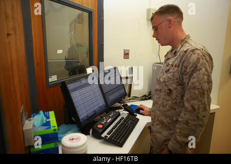 A Navy x-ray technician with 2nd Medical Battalion, Combat Logistics Regiment 25, 2nd Marine Logistics Group, reviews x-ray data at French Creek Medical Center, Camp Lejeune. Stock Photo