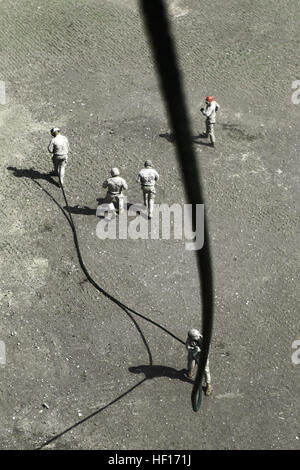 Marines perform a fast-roping exercise from a helicopter in the Pacific ...