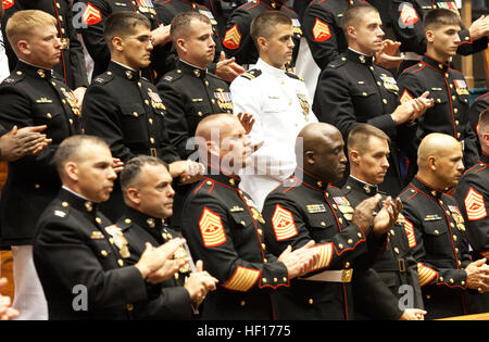 Marines and sailors applaud during the ceremony at the state Capitol honoring their fallen brothers and supporting the families. The Hawaii Medal of Honor is given to service members with Hawaii ties who were killed in action while serving in Operation Iraqi Freedom or Operation Enduring Freedom. Hawaii Medal of Honor ceremony salutes fallen heroes 130327-M-NG901-002 Stock Photo