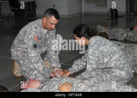 Cross-functional team members with the California National Guard Counterdrug Task Force train approximately 70 Junior Reserve Officers’ Training Corps (JROTC) cadets from several high schools in the Manteca are during Camp Honor at Camp Parks, Calif. The weeklong camp promotes healthy living and positive choices through leadership, teamwork, first aid and drill and ceremony activities. (U.S. Army National Guard photo/1st Lt. Kara Siepmann/ Released) Students become leaders at Camp Honor 130425-Z-RR973-001 Stock Photo