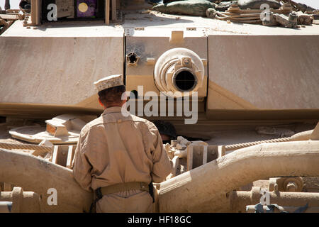 U.S. Marine Corps Staff Sgt. Paul Acevedo, a section leader from Pomona, Calif., assigned to Delta Company, 1st Tank Battalion, Regimental Combat Team 7, (RCT) 7, conducts function checks on an M1A1 Abrams tank on Camp Shir Ghazay, Helmand province, Afghanistan, April 27, 2013. Acevedo alongside the Marines and Sailors of Delta Company deployed to Afghanistan in support of Operation Enduring Freedom. (U.S. Marine Corps photo by Staff Sgt. Ezekiel R. Kitandwe/Released) Delta Company tanks roll through Shir Ghazay 130427-M-RO295-074 Stock Photo