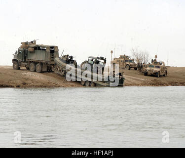 March 5, 2007, Riverine Squadron  (RIVRON-), Detachment 3, st Brigade, 3rd Infantry Division, II Marine Expeditionary Force  prepare to launch a Small Unit Reconassance Craft (SURC) for Operation Gibraltar. The operation consisted of inserting at Riverine Launch Site 4 in Ramadi and extracting at the Al Taqaddum Riverine Launch Site. The operation is to familiarize the arriving RIVRON- with the area that Dam Security Unit 3 (DSU-3), st Brigade, 3rd Infantry Division, II Marine Expeditionary Force  has been covering for the past six months. RIVRON- and DSU-3 are deployed in support of Operation Stock Photo