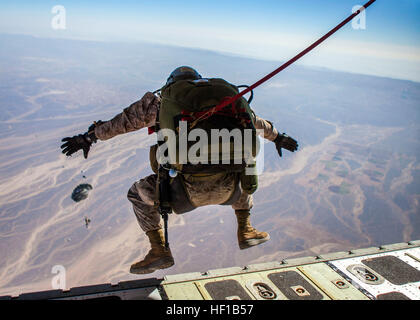 A 26th Marine Expeditionary Unit (MEU) Maritime Raid Force Marine exits a KC-130J Hercules assigned to the 26th MEU command element, during high altitude, high opening parachute operations over King Faisal Air Base in Jordan, June 15, 2013. Exercise Eager Lion 2013 is an annual, multinational exercise designed to strengthen military-to-military relationships and enhance security and stability in the region by responding to realistic, modern-day security scenarios. This is a recurring exercise. The 26th MEU is deployed to the 5th Fleet area of operations as part of the Kearsarge Amphibious Read Stock Photo