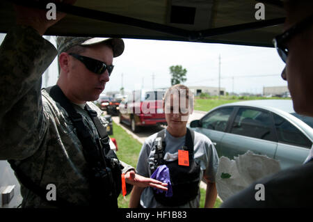 The 63rd Civil Support Team, Oklahoma National Guard, conducts a joint chemical emergency training exercise at the Tulsa Port of Catoosa on June 18, 2013. The team provides information and coordination to prepare for areas potentially contaminated with hazardous agents and coordinates with local authorities to enhance chemical, biological, radiological, and nuclear response capabilities. Stock Photo