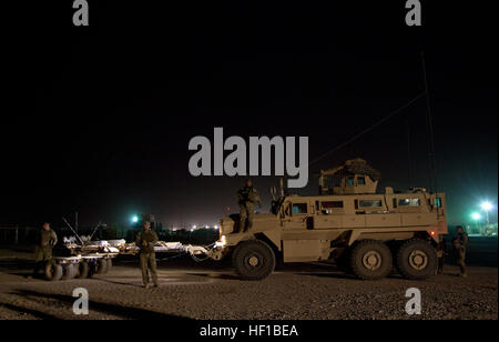 Georgian Army soldiers assigned to the 33rd Light Infantry Battalion stage their vehicles before conducting Operation Northern Lion on Camp Leatherneck, Helmand province, Afghanistan, June 24, 2013. Northern Lion was a Georgian-led operation conducted to deter insurgents, establish a security presence, and gather human intelligence in the area. (U.S. Marine Corps photo by Cpl. Alejandro Pena/Released) Coalition Forces prepare for Operation Northern Lion 10 Stock Photo