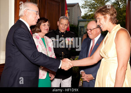 From left, Rep. Howard P. McKeon, U.S. representative of California???s 25th Congressional District and the night's Evening Parade guest of honor; Debbie Paxton; and the Assistant Commandant of the Marine Corps, Gen. John M. Paxton, Jr., the Evening Parade host, greet guests at the Evening Parade reception at the Home of the Commandants in Washington, D.C., July 26, 2013. The Evening Parade, a tradition dating back to July 5, 1957, is offered to express the dignity and pride that represents more than two centuries of heritage for all Americans. (U.S. Marine Corps photo by Adrian R. Rowan/Relea Stock Photo