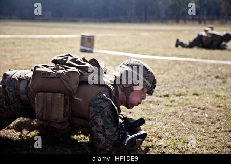 An automatic rifleman from 2nd Battalion, 9th Marine Regiment completes ...