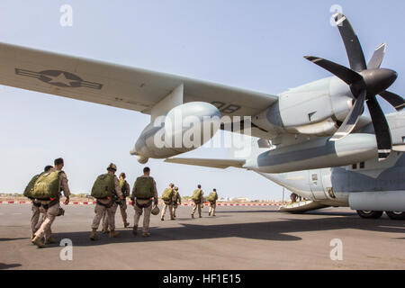 U.S. Marines assigned to 26th Marine Expeditionary Unit (MEU) Command Element and 26th MEU Maritime Raid Force Marines load a KC-130J Super Hercules assigned to Marine Aerial Refueler Transport Squadron (VMGR) 352, to conduct static line, double bag static line, and military freefall parachute operations over Djibouti, Aug. 10, 2013. The 26th MEU is a Marine Air-Ground Task Force forward-deployed to the U.S. 5th Fleet area of responsibility aboard the Kearsarge Amphibious Ready Group serving as a sea-based, expeditionary crisis response force capable of conducting amphibious operations across  Stock Photo