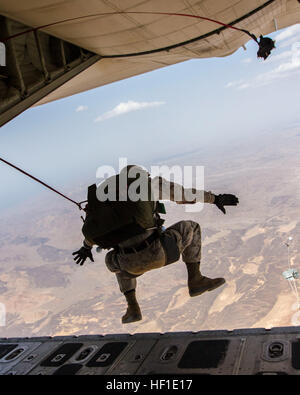 A U.S. Marine with the 26th Marine Expeditionary Unit's Maritime Raid Force conducts double bag static line parachute operations from a KC-130J Super Hercules aircraft assigned to Marine Aerial Refueler Transport Squadron (VMGR) 352 over Djibouti Aug. 10, 2013. Marines with the 26th Marine Expeditionary Unit deployed with the Kearsarge Amphibious Ready Group in the U.S. 5th Fleet area of responsibility. (DoD photo by Sgt. Christopher Q. Stone, U.S. Marine Corps/Released) 130810-M-SO289-011 (9508301735) Stock Photo