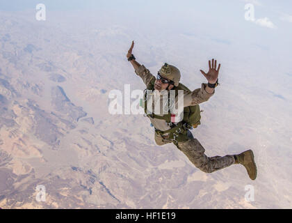 26th Marine Expeditionary Unit (MEU) Maritime Raid Force Marines conduct military freefall parachute operations from a KC-130J Super Hercules assigned to Marine Aerial Refueler Transport Squadron (VMGR) 352, over Djibouti, Aug. 10, 2013. The 26th MEU is a Marine Air-Ground Task Force forward-deployed to the U.S. 5th Fleet area of responsibility aboard the Kearsarge Amphibious Ready Group serving as a sea-based, expeditionary crisis response force capable of conducting amphibious operations across the full range of military operations. (U.S. Marine Corps photo by Sgt. Christopher Q. Stone, 26th Stock Photo