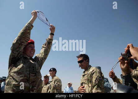 British Army Lieutenant Jess Price, a planning officer with the 3rd military police, receives a letter of appreciation during a ceremony at the Lashkar Gah Training Center (LTC), Helmand province, Afghanistan, Sept. 10, 2013. U.S. Marine Corps Maj. Gen. Walter L. Miller Jr., commanding general of Regional Command (Southwest), and other staff visited the LTC to attend a ribbon cutting ceremony for the opening of a new training compound. (U.S. Marine Corps Photo by Sgt. Tammy K. Hineline/Released) Lashkar Gah Training Center Opening 130910-M-RF397-215