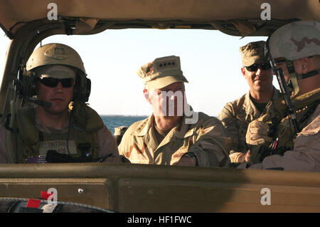 071028-M-0650G-110 CAMP HADITHA, Iraq (Oct. 28, 2007) - Sailors with Riverine Squadron 2, Det. 1, II Marine Expeditionary Force, take Chief of Operations (CNO) Adm. Gary Roughead for a ride in one of the riverine patrol boats. CNO and Master Chief Petty Officer of the Navy (MCPON) Joe R. Campa Jr. visited Sailors throughout the Al Anbar Province of Iraq and thanked them for their dedication to service. U.S. Marine Corps photo by Lance Cpl. Caleb Gomez (RELEASED) US Navy 071028-M-0650G-110 Sailors with Riverine Squadron 2, Det. 1, II Marine Expeditionary Force, take Chief of Operations (CNO) Ad Stock Photo