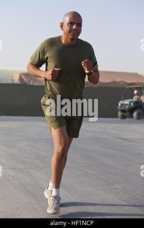 Master Sgt. Marcelino Marquez, Jr., a Marine with Combat Logistics Regiment 2, Regional Command (Southwest), runs a half marathon at Camp Leatherneck, Helmand province, Afghanistan, Oct. 10, 2013. The Marines ran the Jazz Half Marathon to support the cancer program at Children's Hospital in New Orleans, where the official half marathon will take place Oct. 12. Deployed Marines run to support ChildrenE28099s Hospital in New Orleans 131010-M-ZB219-268 Stock Photo