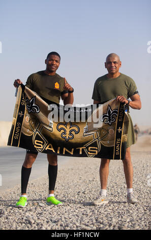 Gunnery Sgt. Morris Mayfield (left) and Master Sgt. Marcelino Marquez, Jr., Marines with Combat Logistics Regiment 2, Regional Command (Southwest), pose for a picture after their half marathon at Camp Leatherneck, Helmand province, Afghanistan, Oct. 10, 2013. The Marines ran the Jazz Half Marathon to support the cancer program at Children's Hospital in New Orleans, where the official half marathon will take place Oct. 12. Deployed Marines run to support ChildrenE28099s Hospital in New Orleans 131010-M-ZB219-423 Stock Photo