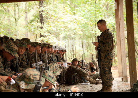 U.S. Marines from Delta Company, Infantry Training Battalion (ITB), School of Infantry - East (SOI-E) receive Anti-Personnel Mine instruction from their combat instructors, Camp Geiger, N.C., Oct. 11, 2013. As part of a measured, deliberate and responsible collection of data on the performance of female Marines when executing existing infantry tasks and training events, the Marine Corps is soliciting entry-level female Marine volunteers to attend the eight week basic infantryman and infantry rifleman training courses at ITB.  (U. S. Marine Corps photo by Cpl. Maricela Veliz, Combat Camera, SOI Stock Photo