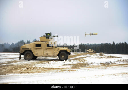 Paratroopers assigned to Destined Company, 2nd Battalion, 503rd Infantry Regiment, 173rd Infantry Brigade Combat Team (Airborne) out of Vicenza, Italy, fire a TOW 2b missile  during a live-fire exercise at the Joint Multinational Training Command in Grafenwoehr, Germany, Feb. 1, 2014. (Photo by US Army Staff Sergeant Pablo N. Piedra/released) Live-fire TOW 2B exercise (Image 2 of 10) (12328762655) Stock Photo