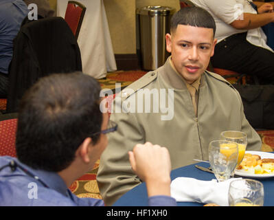 2nd Lt. Jose Valle, a Marine Corps Recruiting Command MAES Leadership Conference trainer, has a conversation with a MAES member during breakfast at the Hilton Garden Inn in El Paso, Texas, 6 February, 2014. The Marine Corps and MAES partnership is one way how the Marines are committed to making a concerted effort to attract, mentor, and retain the most talented men and women who bring a diversity of background, culture and skill in service to our nation. Marine Corps Partners with MAES 140206-M-JI948-079 Stock Photo