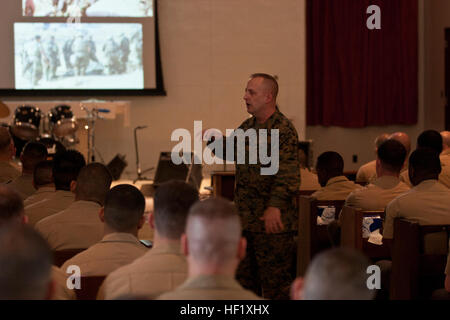 Sgt. Maj. Justin D. Lehew speaks with students and faculty participating in the Staff Non-Commissioned Officers Academy Feb. 6 at the West Chapel on Camp Hansen regarding his personal experiences in the Marine Corps and how those in attendance can expand their knowledge of history and tradition. Lehew earned the Navy Cross, the second highest award for combat valor after the Medal of Honor, for his actions March 23-24, 2003 during the Battle of An-Nasiriyah. The battle took place during the initial invasion of Iraq, in support of Operation Iraqi Freedom. Lehew is the command sergeant major of  Stock Photo