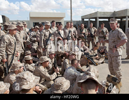 U.S. Marine Corps Brig. Gen. James O'Meara, right, deputy commander of U.S. Marine Corps Forces Europe and Africa, speaks to U.S. Marines and Sailors from Battalion Landing Team (BLT) 1st Battalion, 6th Marine Regiment, 22nd Marine Expeditionary Unit (MEU), after the BLT completed an amphibious assault exercise at the Israel Defense Forces (IDF) National Training Center, Israel, March 10, 2014, as part of Exercise Noble Shirley 2014. Noble Shirley is a recurring, scheduled bilateral training exercise with the IDF. The MEU is deployed to the U.S. 6th Fleet area of operations with the Bataan Amp Stock Photo