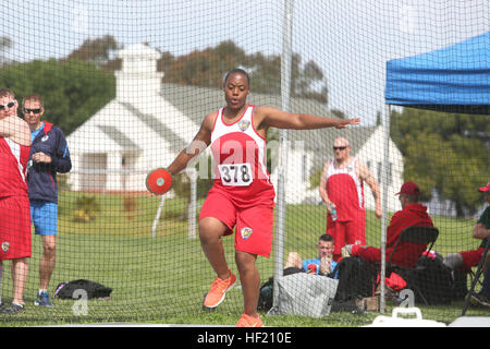 Lance Cpl. Tiffany Johnson, 22, from Chicago, with Wounded Warrior Battalion East, spins as to gain momentum just before throwing the discus into the field during the field competition during the Marine Corps Trials aboard Camp Pendleton, Calif., March 11, 2014. The Marine Corps Wounded Warrior Regiment enables wounded, ill, or injured Marines to focus on their abilities and to find new avenues to thrive.  The fourth annual Marine Corps Trials is being held at Marine Corps Base Camp Pendleton, Calif., March 4-12.  Athletes will compete in archery, cycling, shooting, swimming, track, field, sit Stock Photo