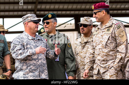 Col. Albert J. Ricci Sr., commander of the 42nd Combat Aviation Brigade (CAB), speaks to Maj. Gen. Prince Fahad bin Turki Abdulaziz Al-Saud,  Royal Saudi Land Forces, during a practice air assault during Exercise Friendship and Iron Hawk 14 on April 10th, 2014, near Tabuk, Saudi Arabia.  Iron Hawk and Friendship 14 involved U.S. Army forces from the 42nd CAB, New York Army National Guard, and 2nd Brigade Combat Team, 4th Infantry Division, and Saudi Arabian ground and aviation forces.  Over weeks of practice the two militaries focused on improving their joint operating capabilities, integratin Stock Photo