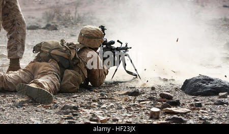 A U.S. Marine with Battalion Landing Team 1st Battalion, 6th Marine Regiment, 22nd Marine Expeditionary Unit (MEU), provides suppressing fire during a live-fire assault as part of a U.S.-French bilateral exercise. The exercise is designed to improve interoperability between nations, increase readiness and develop professional relationships. The 22nd MEU is deployed with the Bataan Amphibious Ready Group as a theater reserve and crisis response force throughout U.S. Central Command and the U.S. 5th Fleet area of responsibility. (U.S. Marine Corps photo by Cpl. Caleb McDonald/Released) 22nd MEU  Stock Photo