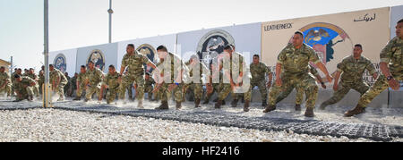 Royal Tongan Marines assigned to Tranche 7, the seventh and final rotational contingent of Royal Tongan Marines to Afghanistan, participate in a 'haka,' a ceremonial dance, during a flag lowering ceremony aboard Camp Leatherneck, Helmand province, Afghanistan, April 28, 2014. The lowering of the flag symbolizes the end of the Kingdom of Tonga's participation in Operation Enduring Freedom and return to their homeland. (Official U.S. Marine Corps photo by Lance Cpl. Darien J. Bjorndal, Marine Expeditionary Brigade Afghanistan/ Released) Royal Tongan Marines Haka Dance, Afghanistan 2014 Stock Photo